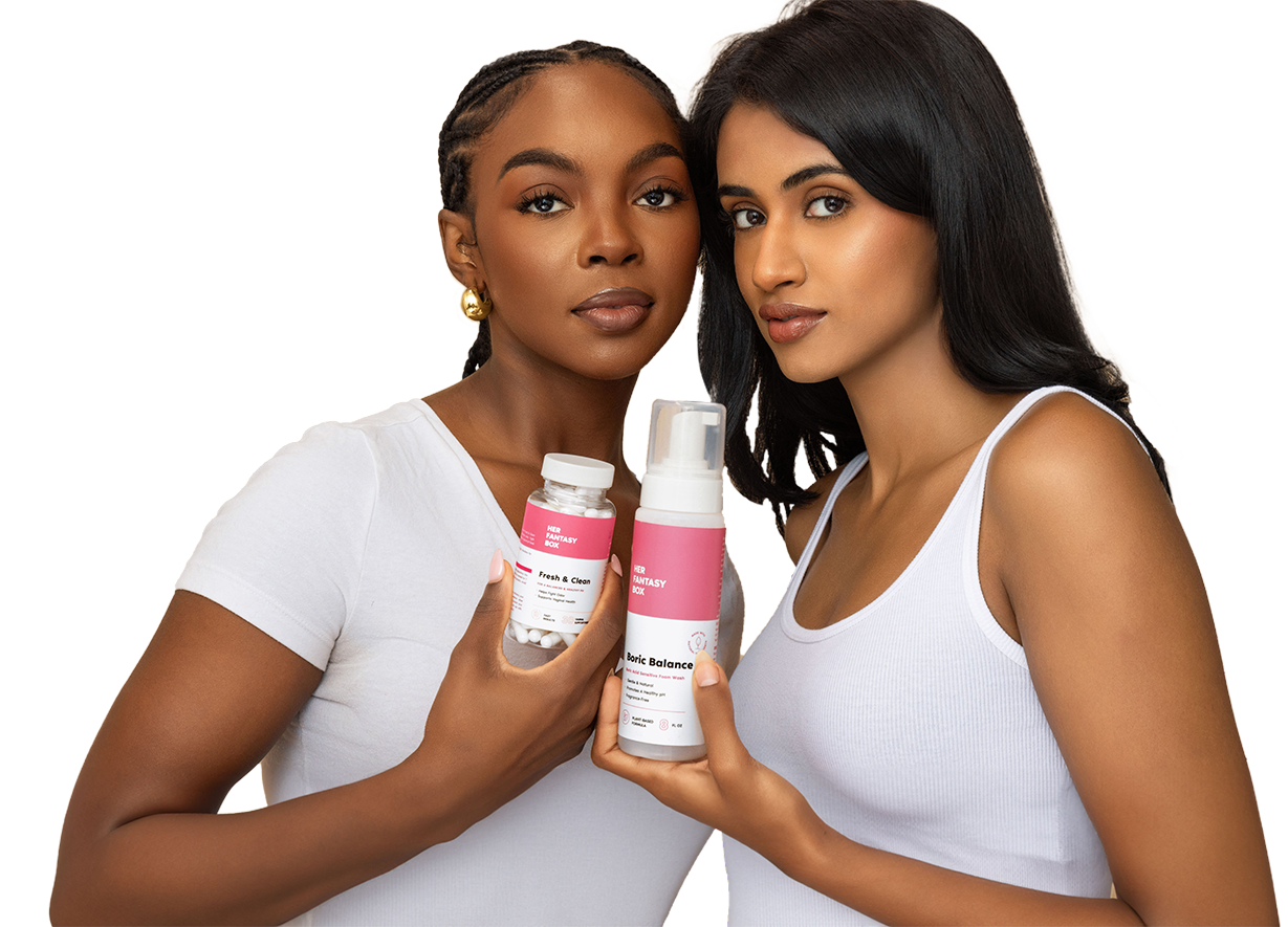 Two women in white tops holding Her Fantasy Box Fresh & Clean capsules and Boric Balance foam wash.